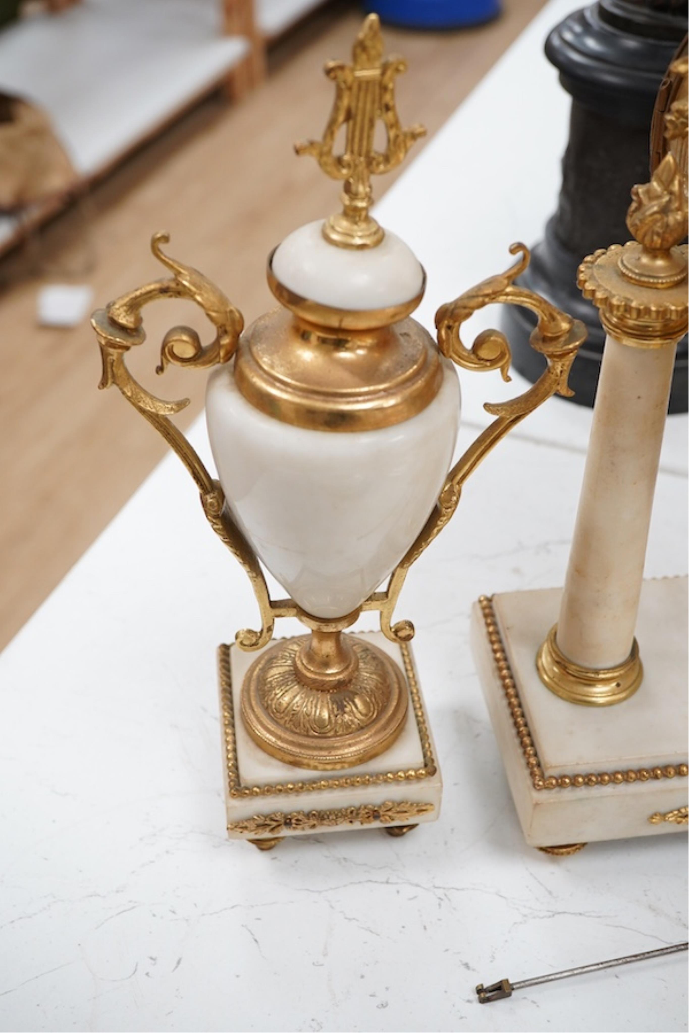 A late 19th century French gilt metal mounted clock garniture, 41cm